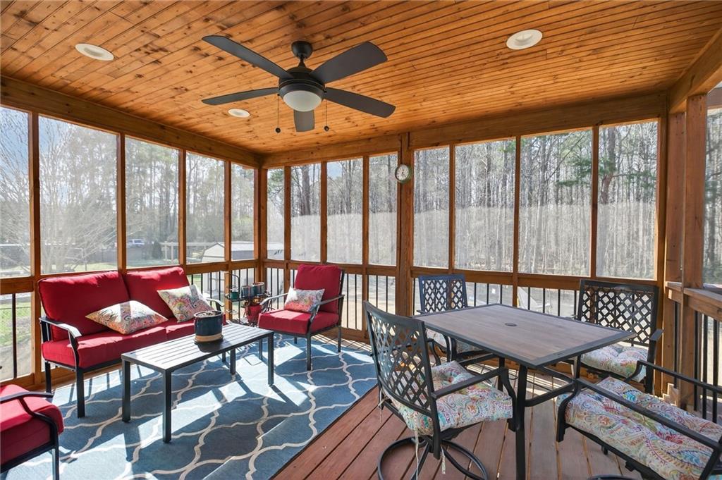143 Autumn Run Place Villa Rica, GA 30180 - Photo 26 of 30 a balcony with furniture and wooden floor