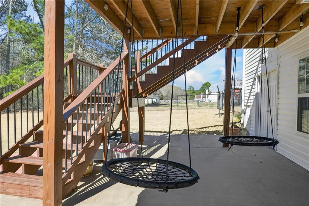 143 Autumn Run Place Villa Rica, GA 30180 - Photo 28 of 30 a view of staircase with a rug
