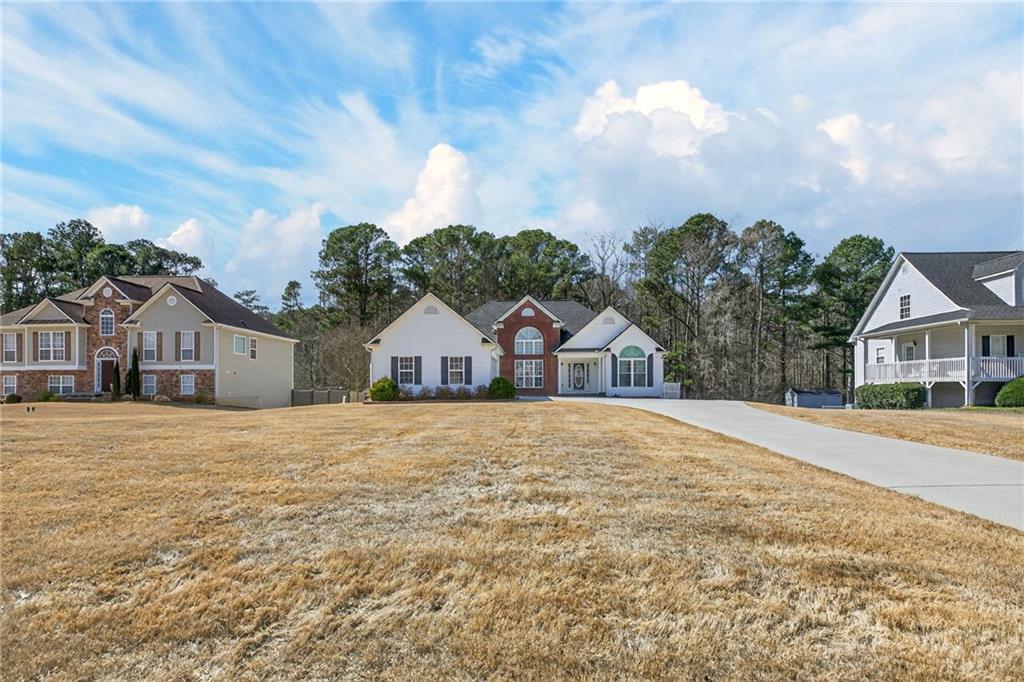 143 Autumn Run Place Villa Rica, GA 30180 - Photo 3 of 30 a front view of a house with a yard and garage