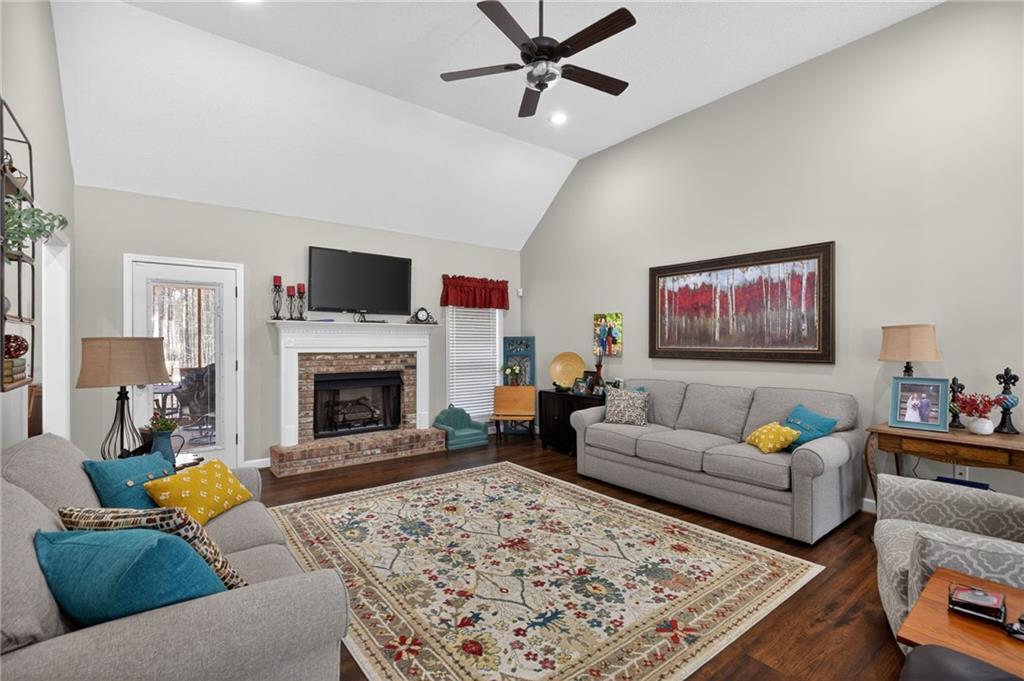 143 Autumn Run Place Villa Rica, GA 30180 - Photo 5 of 30 a living room with furniture and a fireplace