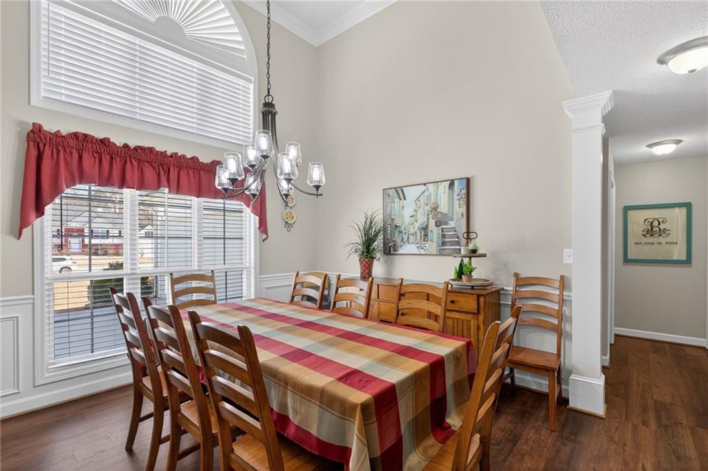 143 Autumn Run Place Villa Rica, GA 30180 - Photo 9 of 30 a dining room with furniture and wooden floor