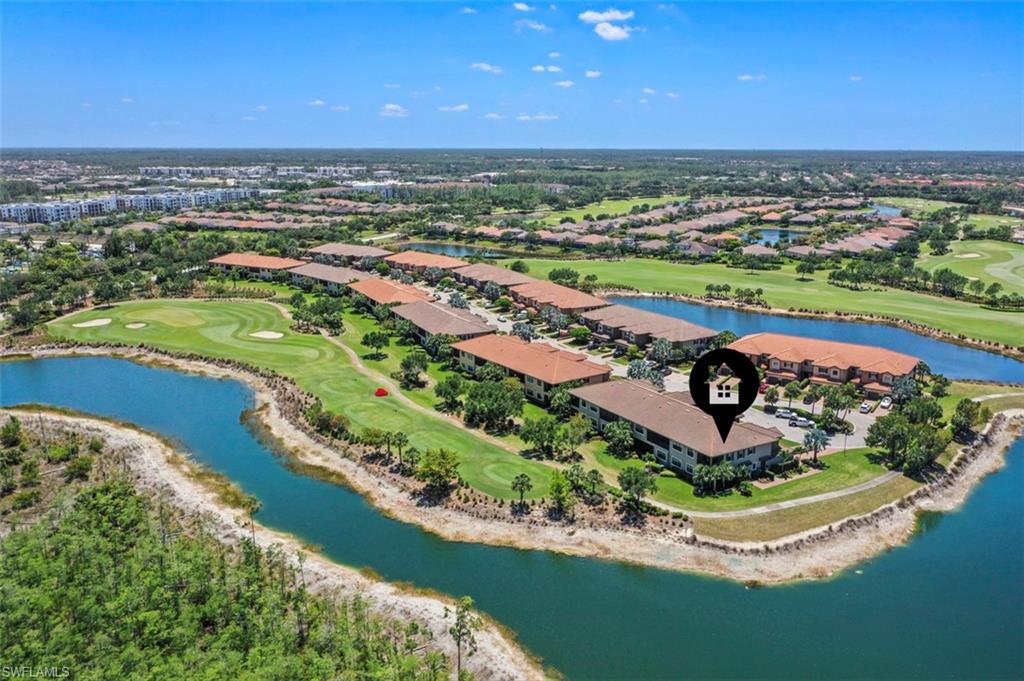 8777 Bellano Court, Unit 101 Naples, FL 34119 - Photo 1 of 39 an aerial view of a city with a lake view