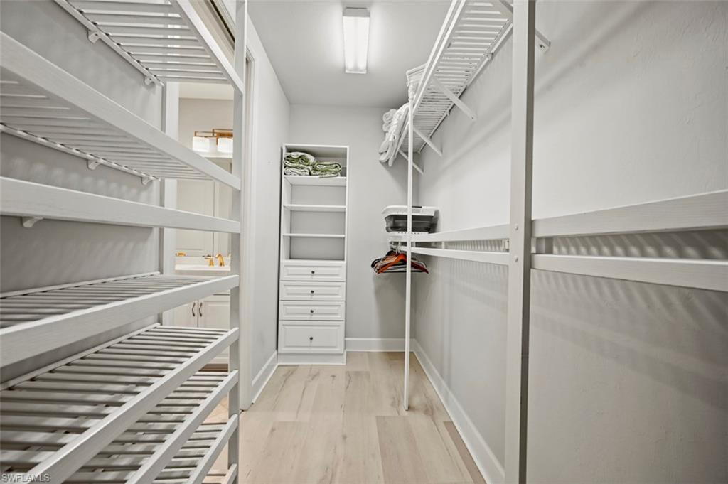 8777 Bellano Court, Unit 101 Naples, FL 34119 - Photo 12 of 39 a view of walk in closet