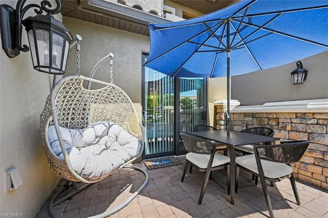 a view of a dining room with furniture and chandelier