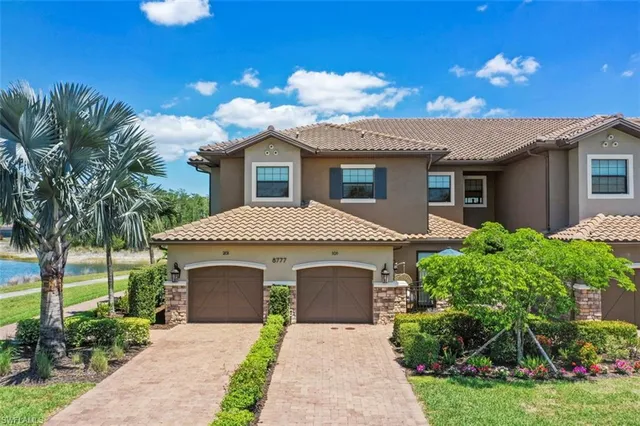 a front view of a house with yard