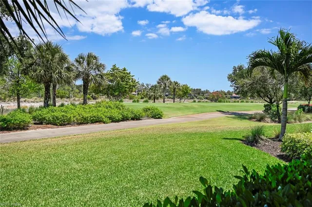 a view of a lake with a yard