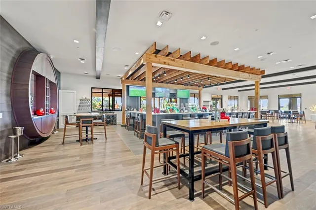 a dining room with furniture and wooden floor