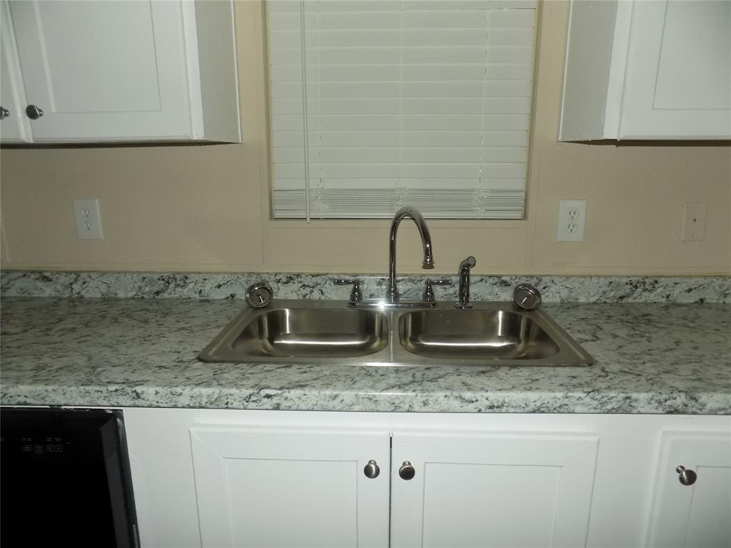 203 South Ridgeview Court Azle, TX 76020 - Photo 7 of 29 New dual stainless sink and faucets.