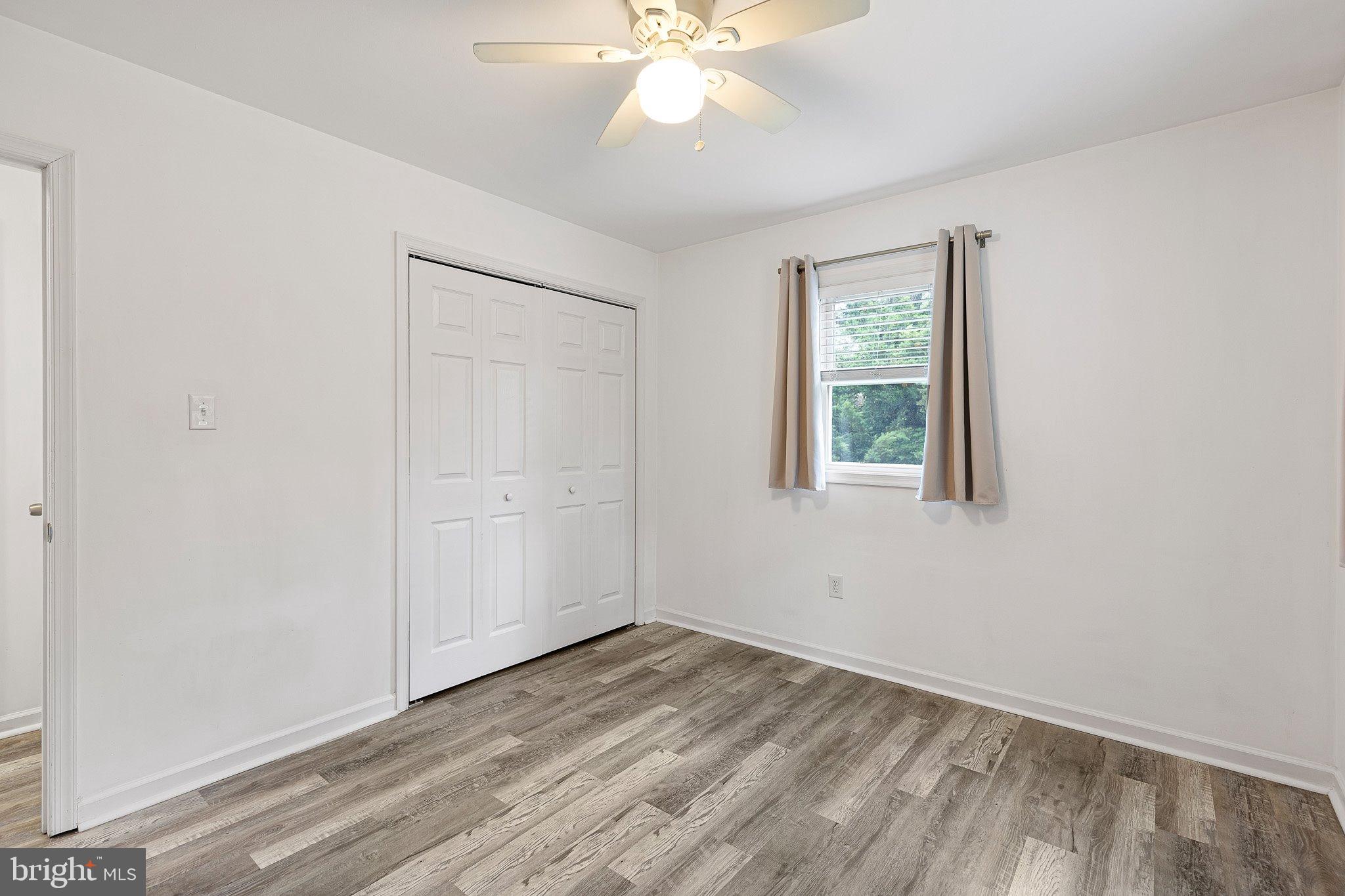 370 Big Elk Chapel Road Elkton, MD 21921 - Photo 20 of 29 wooden floor in an empty room with a window