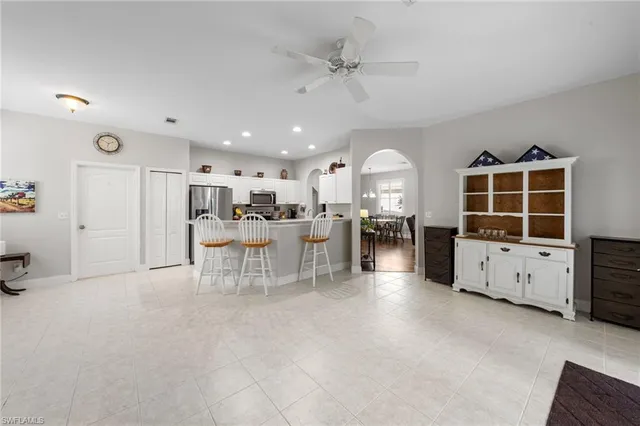 a view of a dining room with furniture and a chandelier