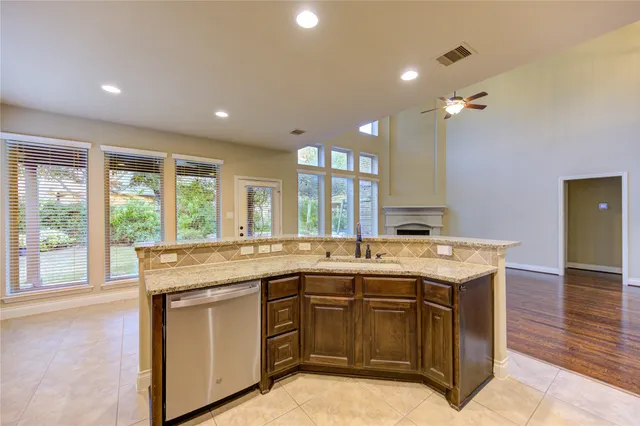 a kitchen with a sink and a stove
