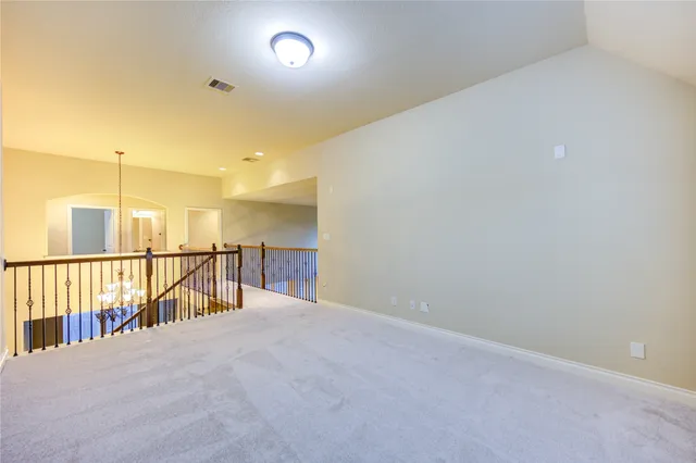 a view of a hallway with windows