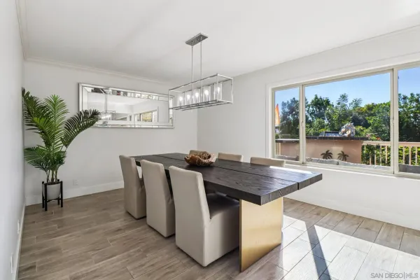 a table with chairs and wooden floor