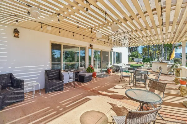 a outdoor space with patio the couches and kitchen view