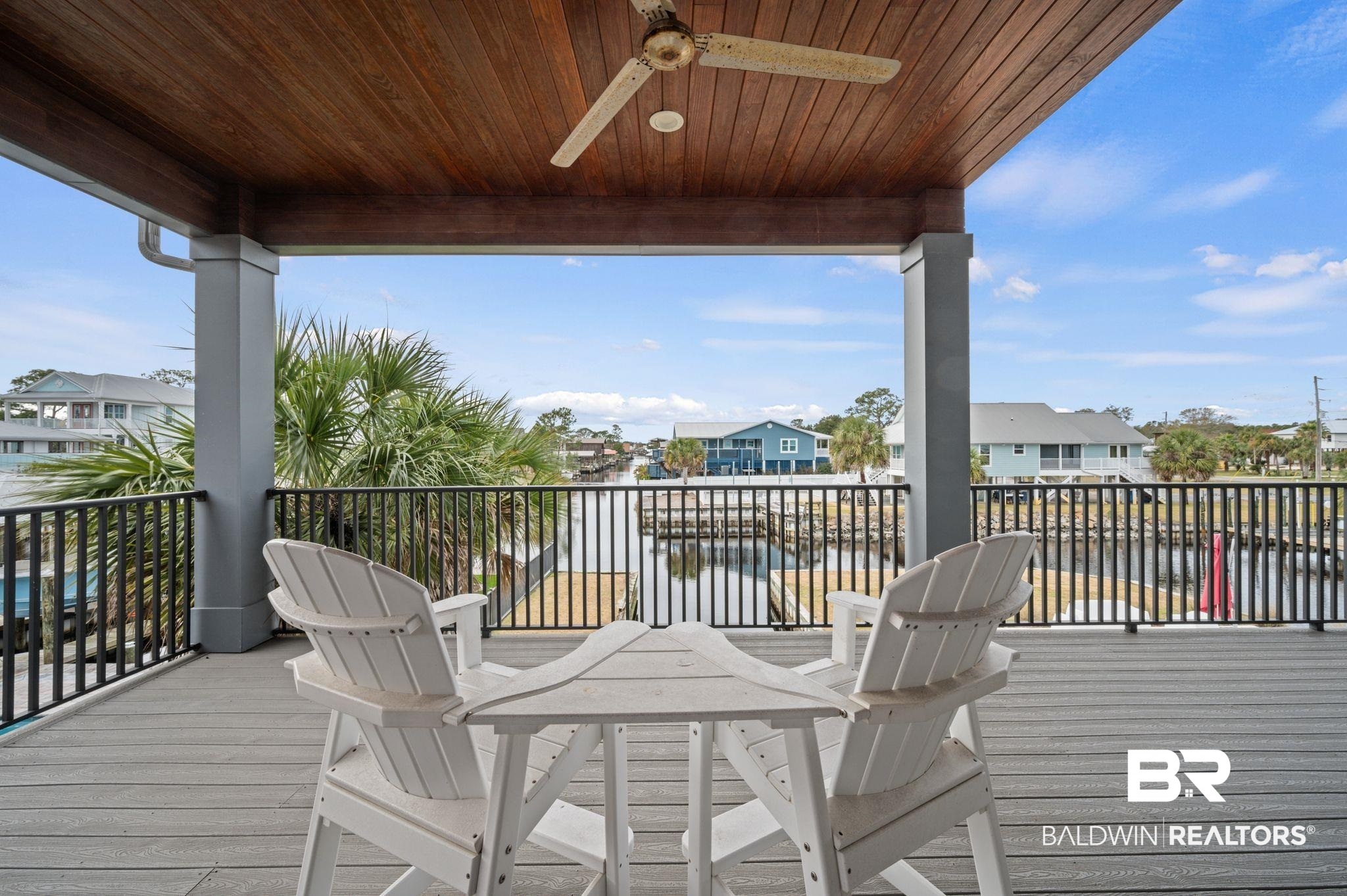 3840 Cotton Way Orange Beach, AL 36561 - Photo 41 of 75 Wooden deck with ceiling fan and a water view