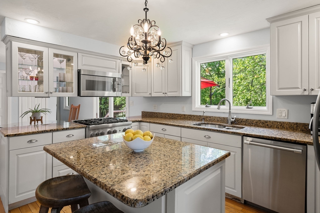 11 Cow Hill Road Sharon, MA 02067 - Photo 8 of 30 a kitchen with a sink a window and chairs