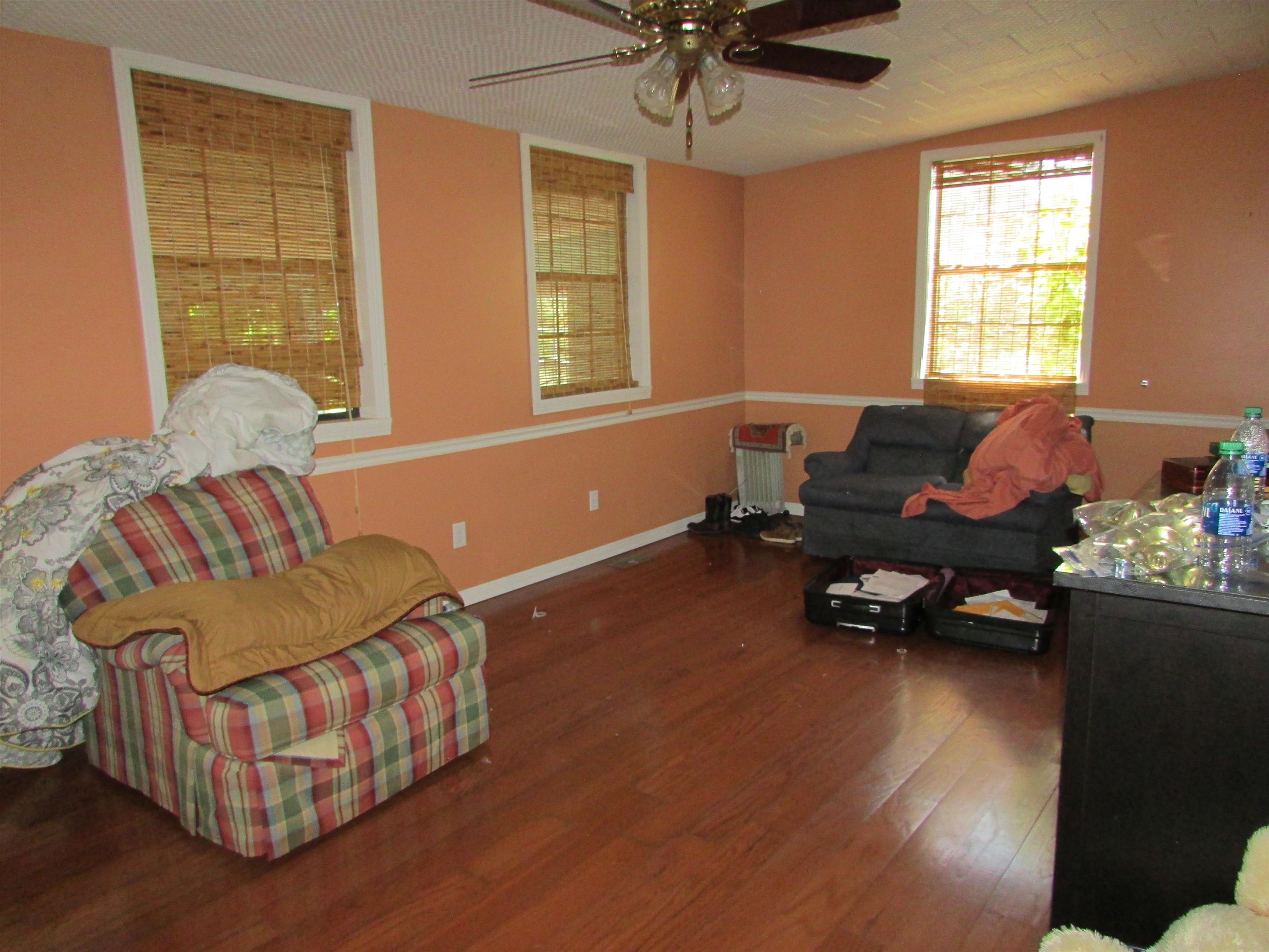 139 Plunk Drive Adamsville, TN 38310 - Photo 15 of 25 a living room with furniture and a window