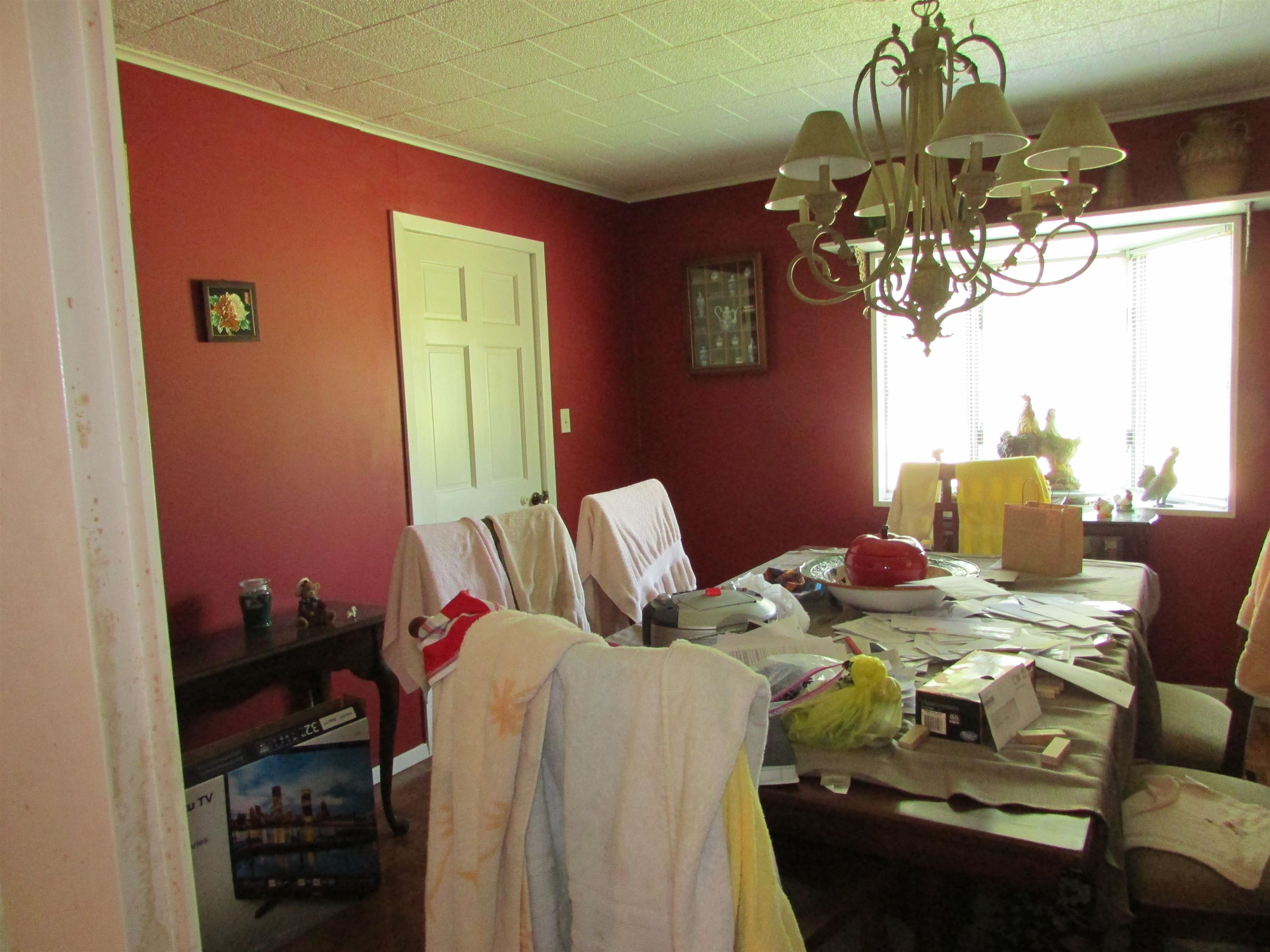 139 Plunk Drive Adamsville, TN 38310 - Photo 5 of 25 a bed room with a bed mirror and a window