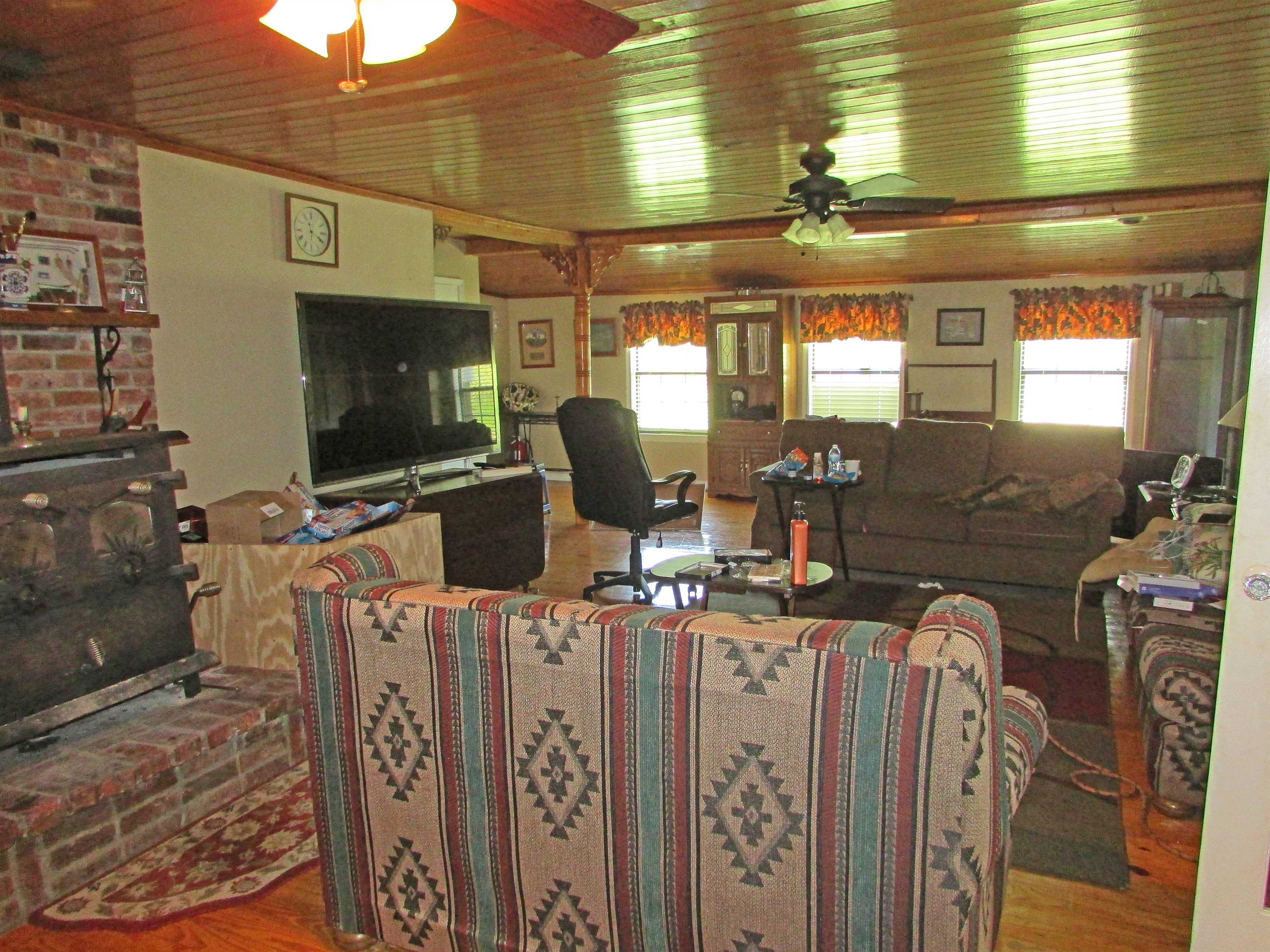 139 Plunk Drive Adamsville, TN 38310 - Photo 7 of 25 a room with lots of appliances and furniture