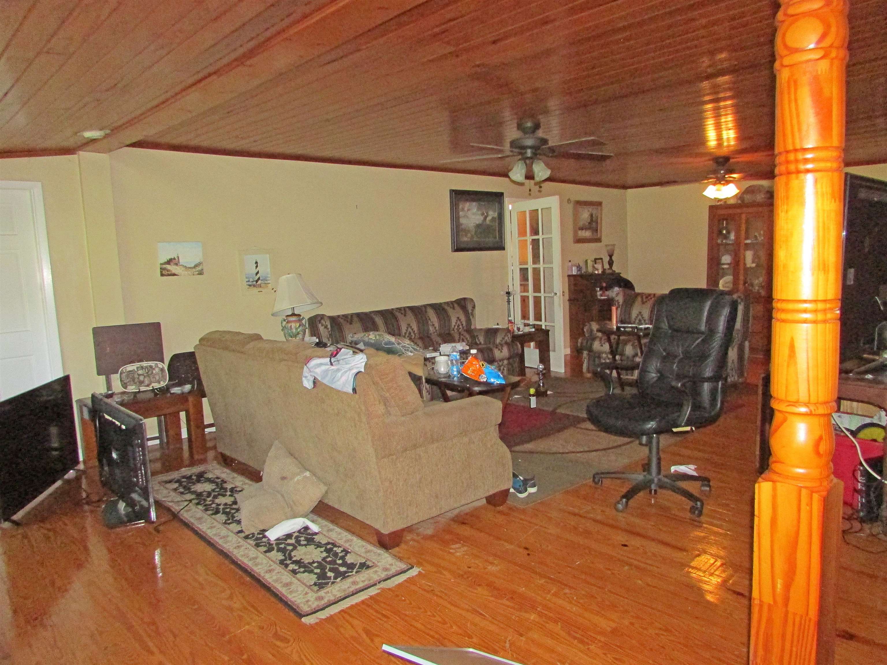 139 Plunk Drive Adamsville, TN 38310 - Photo 8 of 25 a bed sitting in a bedroom next to a window