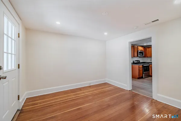 a view of a livingroom with wooden floor