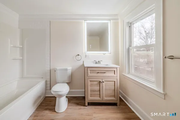 a bathroom with a toilet sink and a bathtub