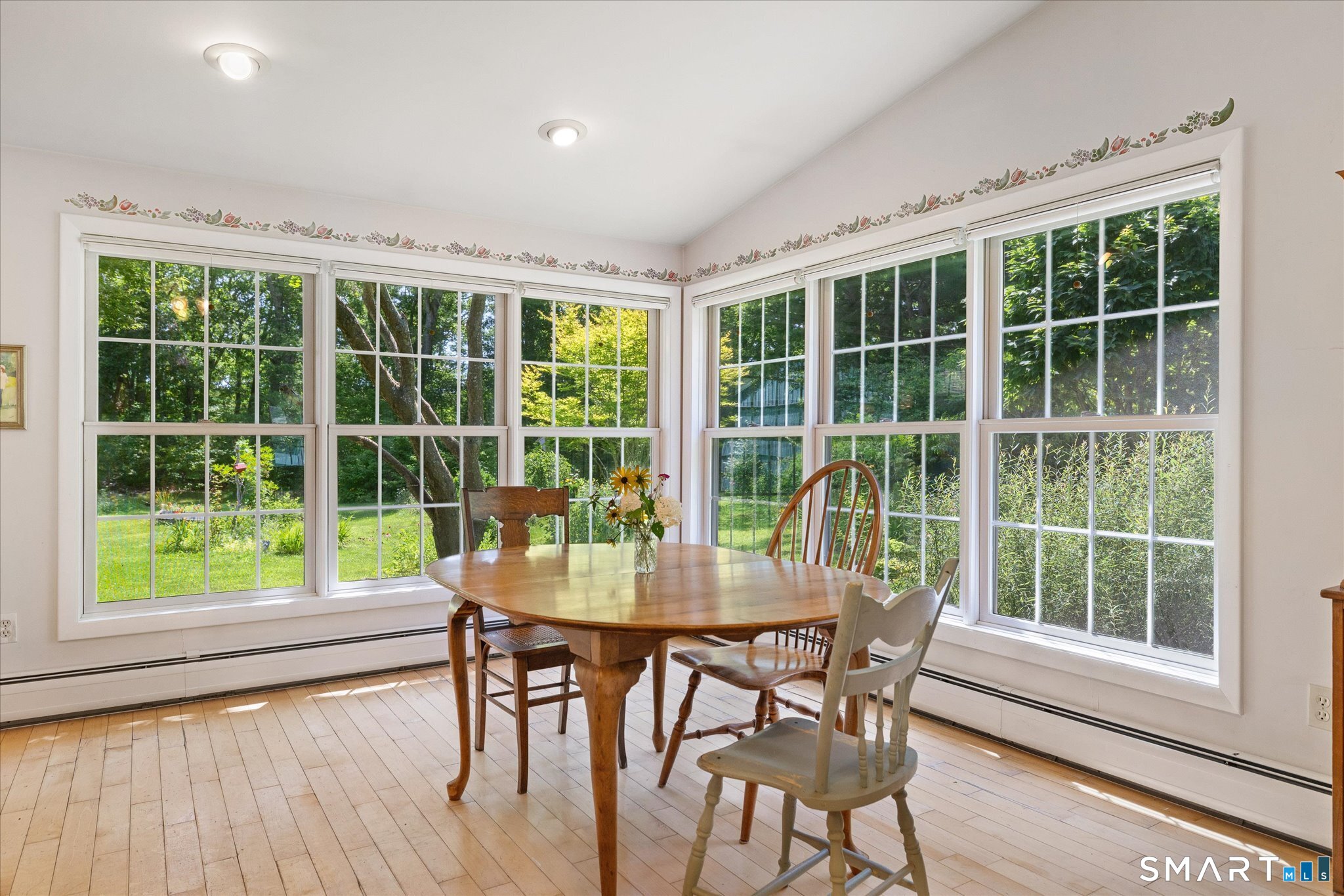 19 Beckwith Street Killingly, CT 06239 - Photo 19 of 39 a view of a dining room with furniture window and wooden floor