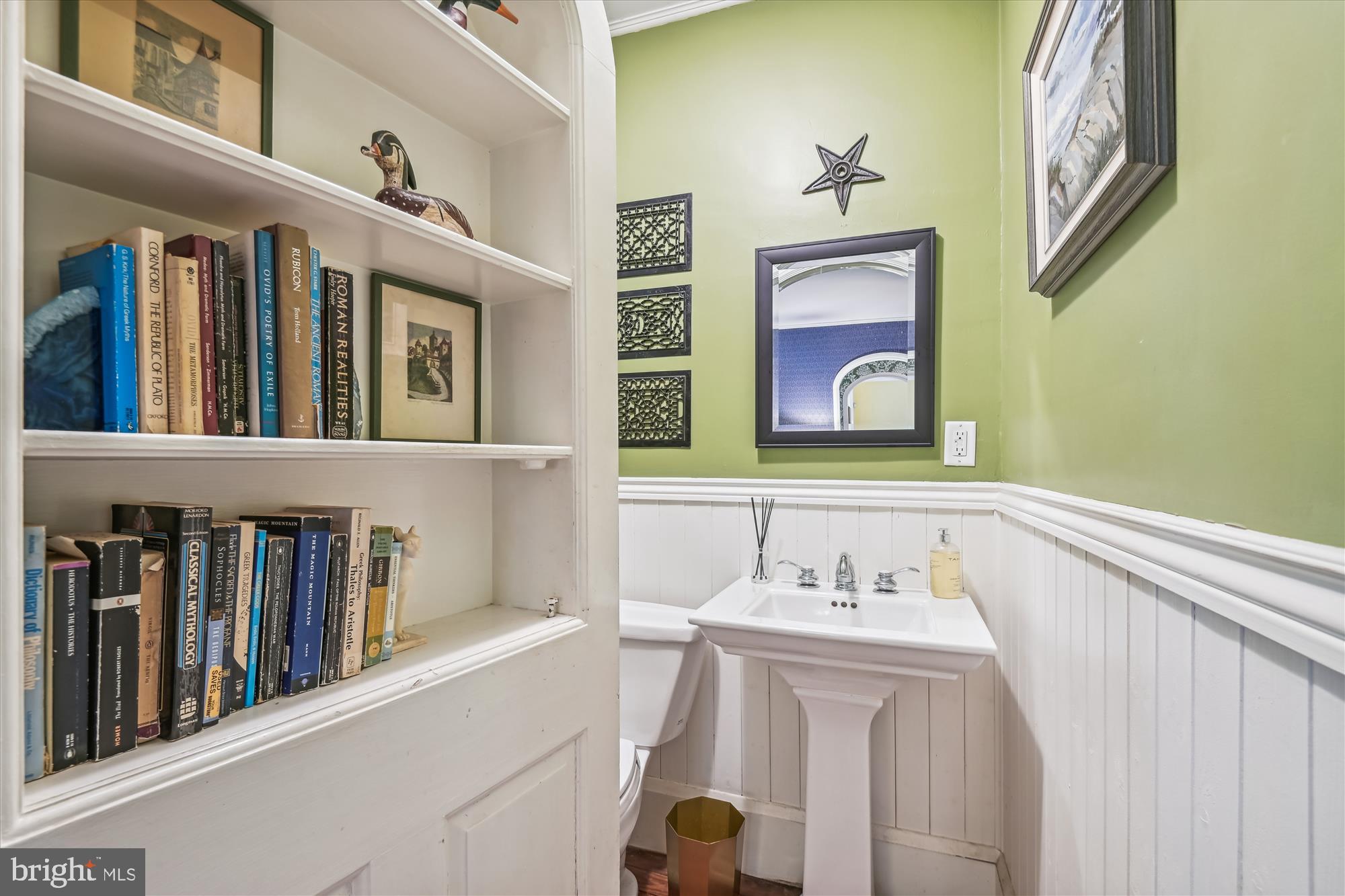 4708 Butler Road Glyndon, MD 21136 - Photo 13 of 58 Bookcase is concealed door to Powder Room
