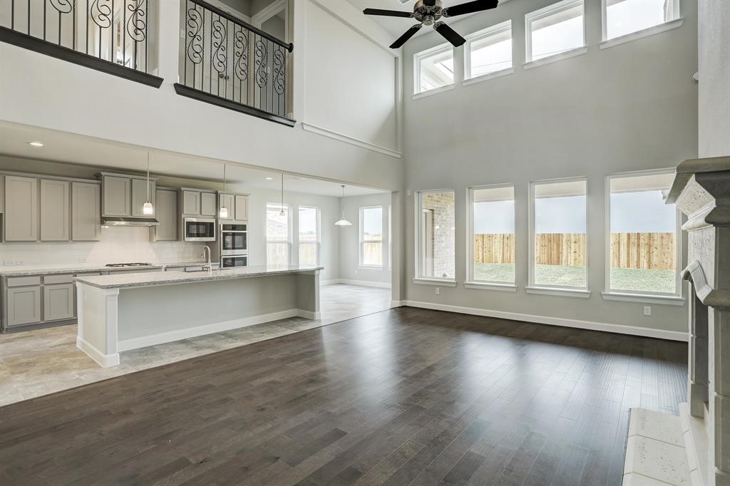 12923 Lott Avenue Houston, TX 77089 - Photo 11 of 23 a kitchen with stainless steel appliances granite countertop a stove a sink and a refrigerator