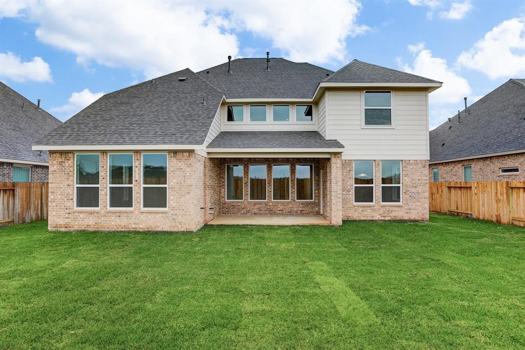 12923 Lott Avenue Houston, TX 77089 - Photo 20 of 23 a front view of a house with a yard