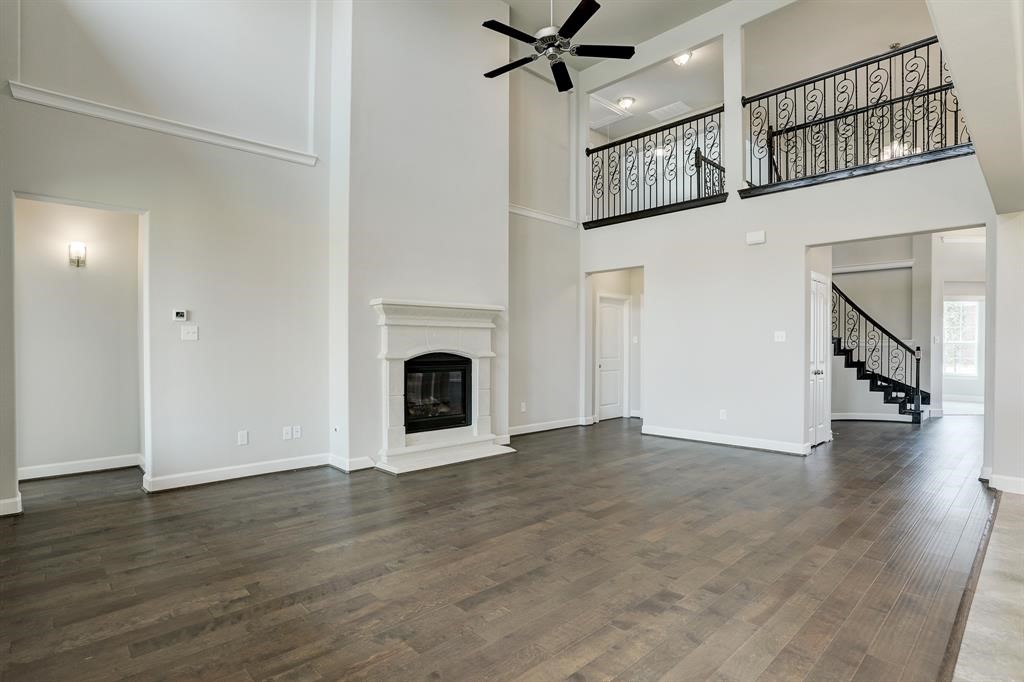 12923 Lott Avenue Houston, TX 77089 - Photo 9 of 23 a view of an empty room with wooden floor and a window