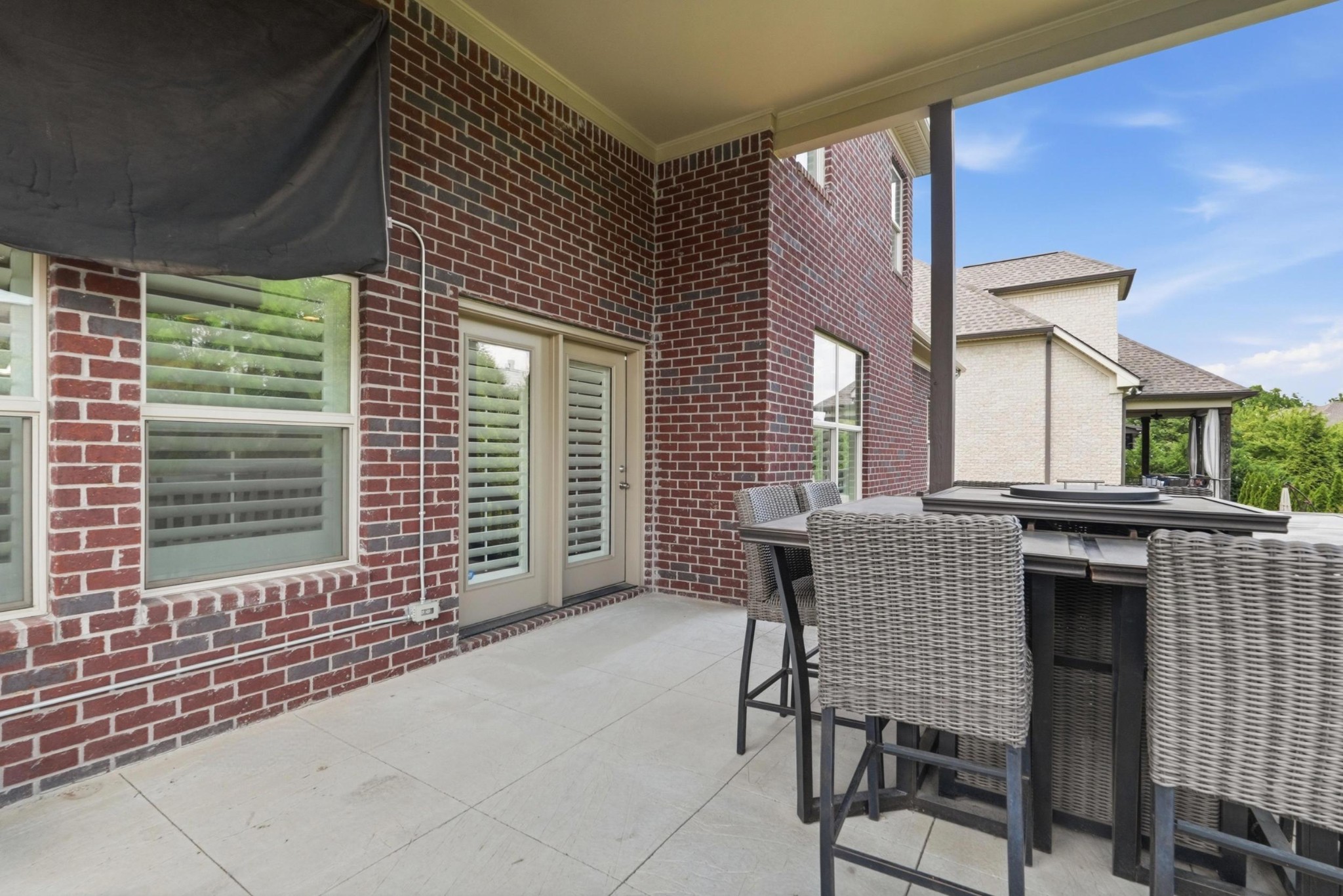 6000 Wallaby Court Spring Hill, TN 37174 - Photo 44 of 57 a backyard of a house with barbeque oven table and chairs