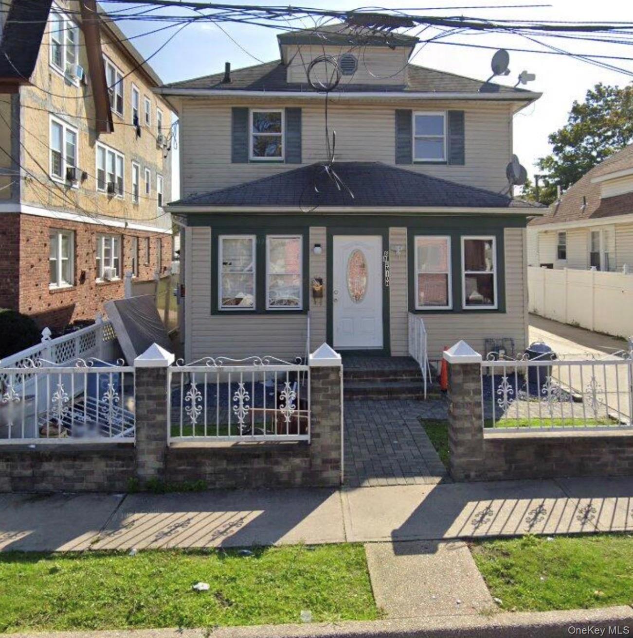 88 Union Place Hempstead, NY 11550 - Photo 1 of 1 a front view of a house with garden