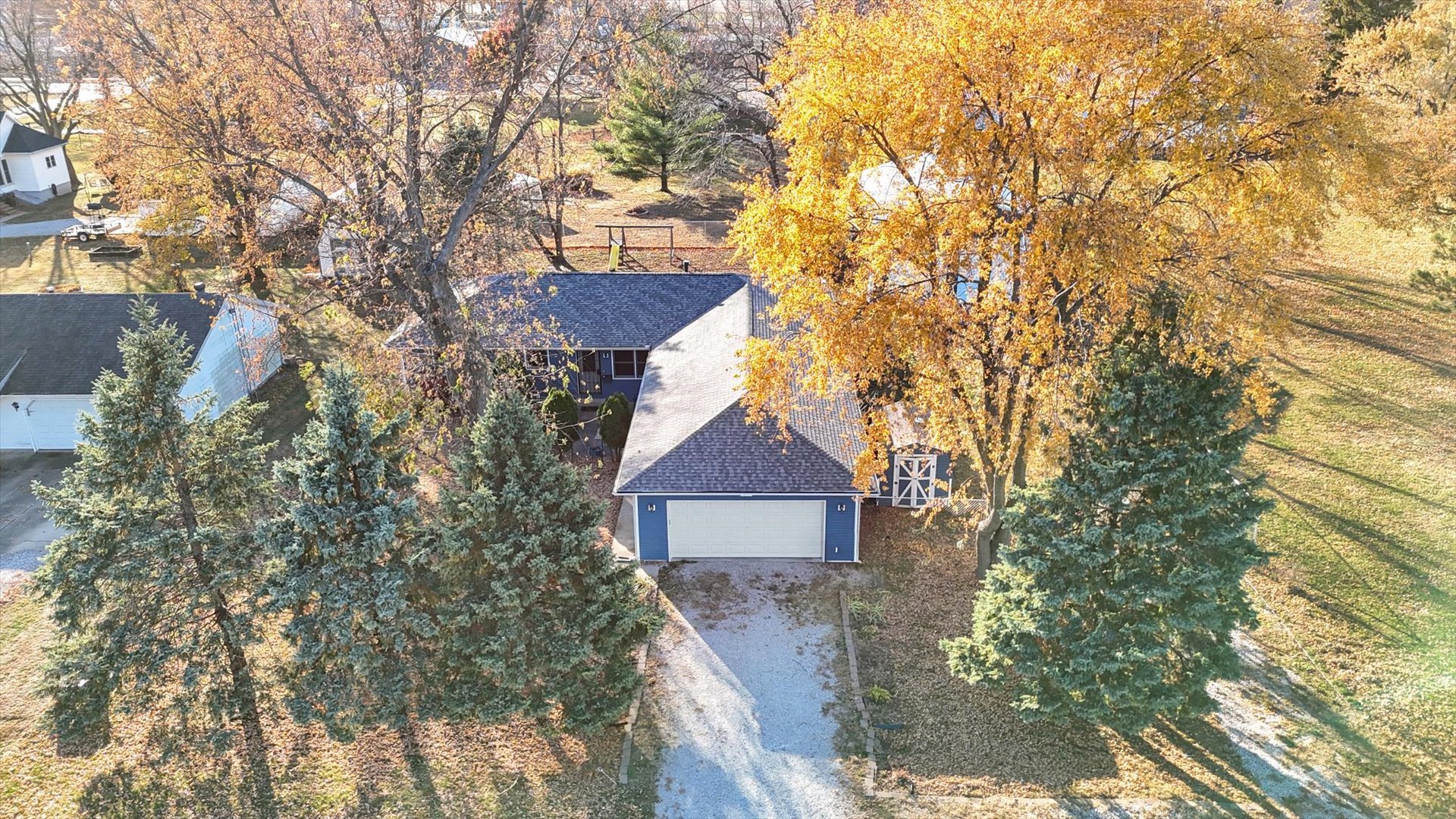 849 North Piatt Street Bement, IL 61813 - Photo 34 of 41 a front view of a house with a yard and trees