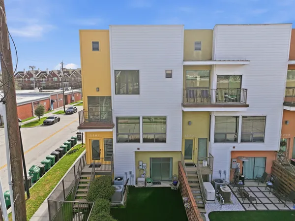 a front view of a building with a yard