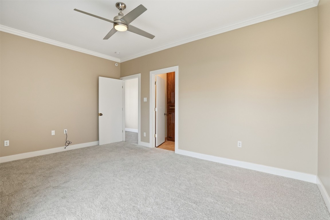 2301 Crawford Street Houston, TX 77004 - Photo 13 of 32 The first-floor bedroom offers exceptional flexibility and could easily serve as a secondary primary suite. With its own private entry accessed through the gated front yard, it’s an ideal retreat for long-term guests, multigenerational living, or added privacy for visitors.