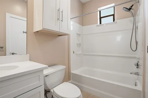 a bathroom with a sink a toilet and a bathtub