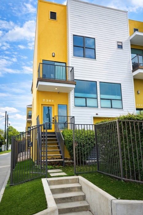 2301 Crawford Street Houston, TX 77004 - Photo 3 of 32 Step into 2301 Crawford Street, a corner-unit home in Houston offering stunning, unobstructed views of Downtown Houston. Enjoy abundant natural light, added privacy, and a rare private fenced-in yard — perfect for relaxing or entertaining with the skyline as your backdrop.