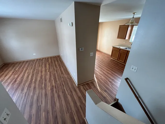 a view of wooden floor in a bathroom