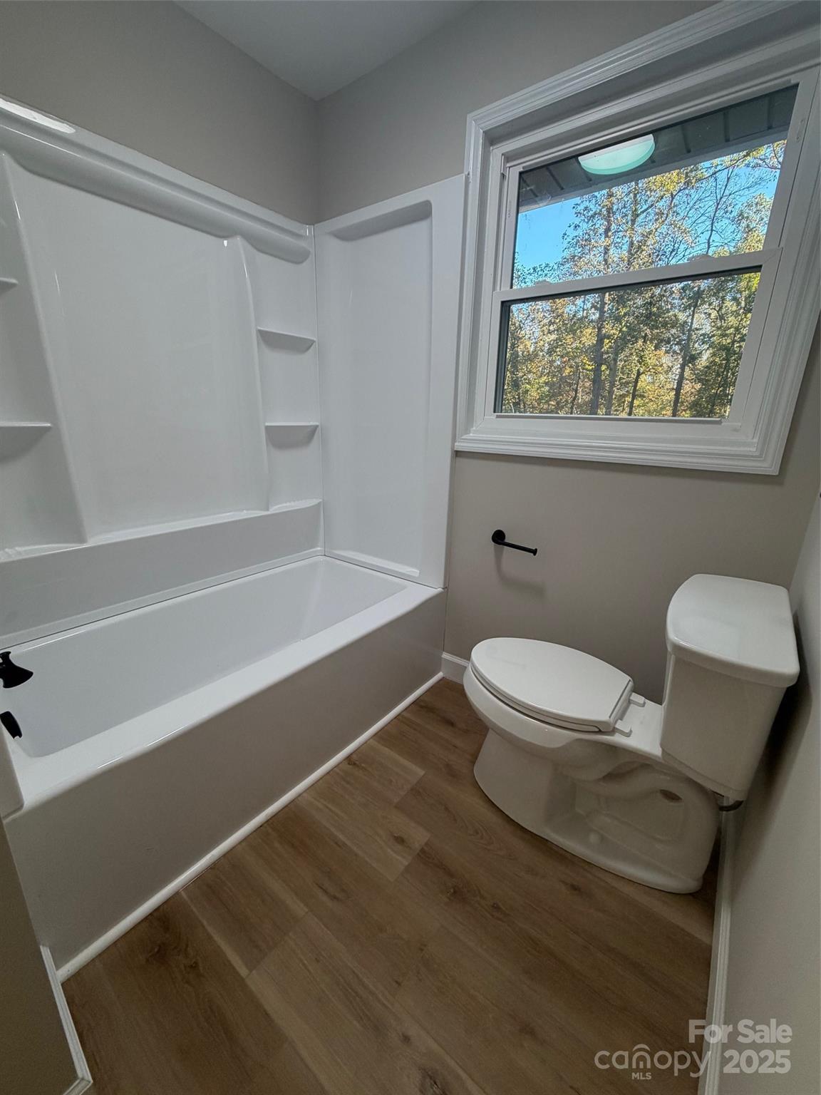 1470 Requa Road Cherryville, NC 28021 - Photo 13 of 28 a white toilet sitting next to a window