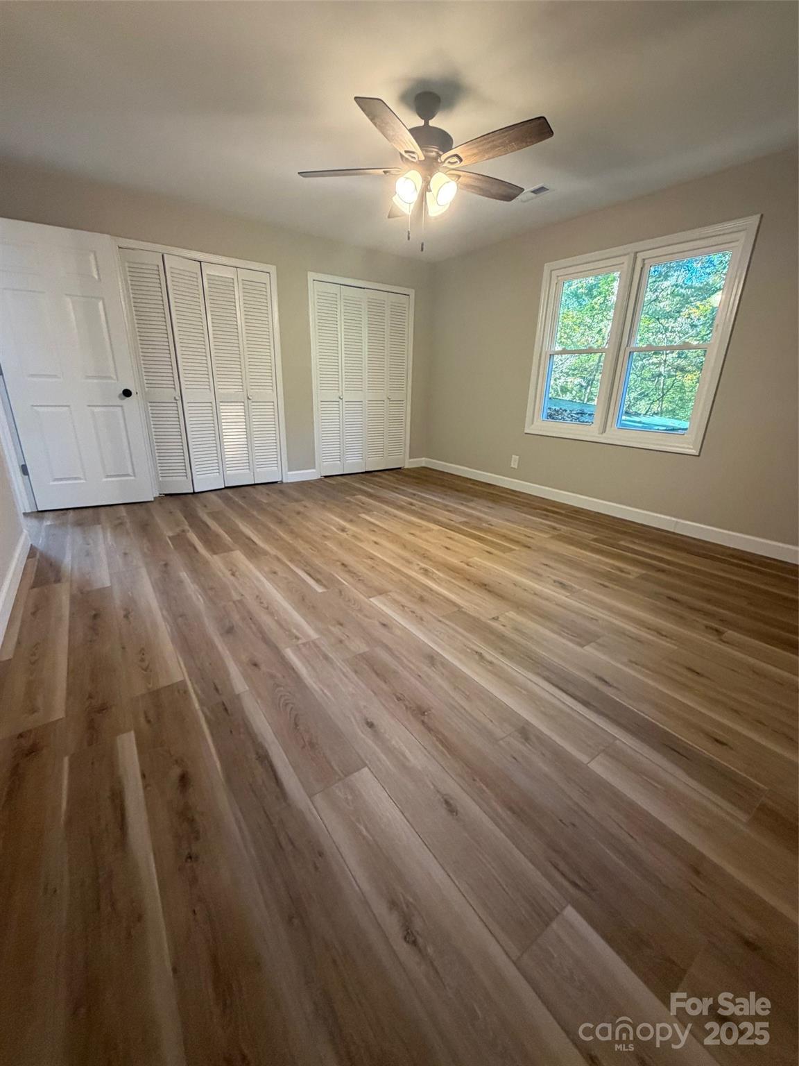 1470 Requa Road Cherryville, NC 28021 - Photo 15 of 28 wooden floor in an empty room with a window