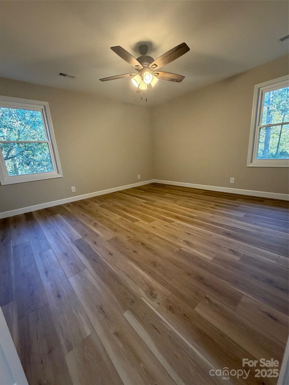 1470 Requa Road Cherryville, NC 28021 - Photo 16 of 28 a view of an empty room with wooden floor and a window