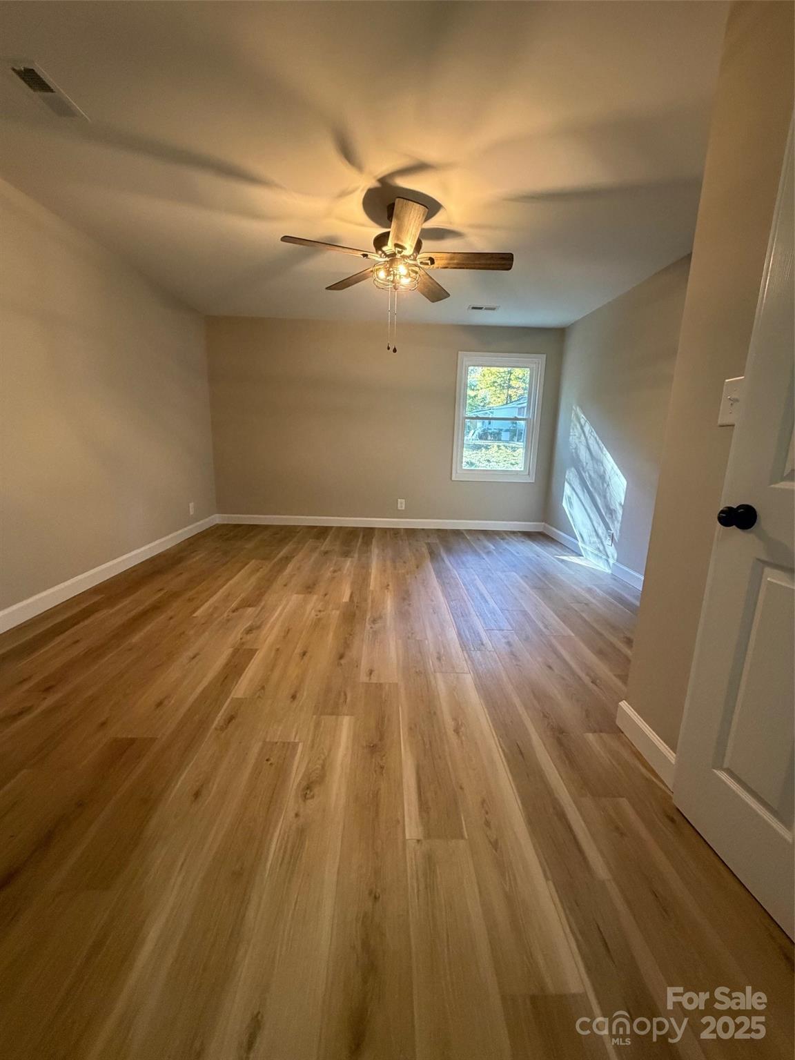 1470 Requa Road Cherryville, NC 28021 - Photo 18 of 28 wooden floor in an empty room with a window