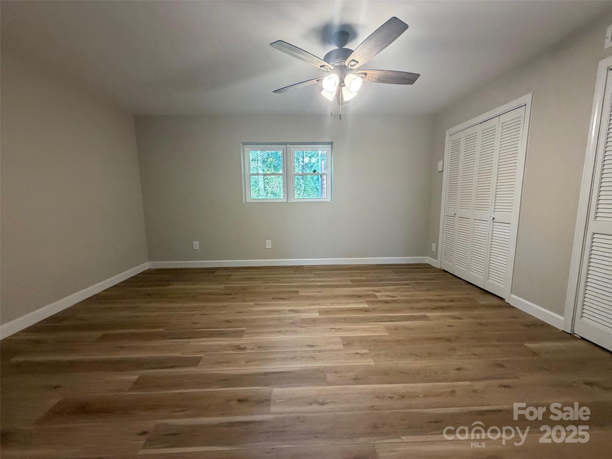 1470 Requa Road Cherryville, NC 28021 - Photo 7 of 28 an empty room with wooden floor and windows