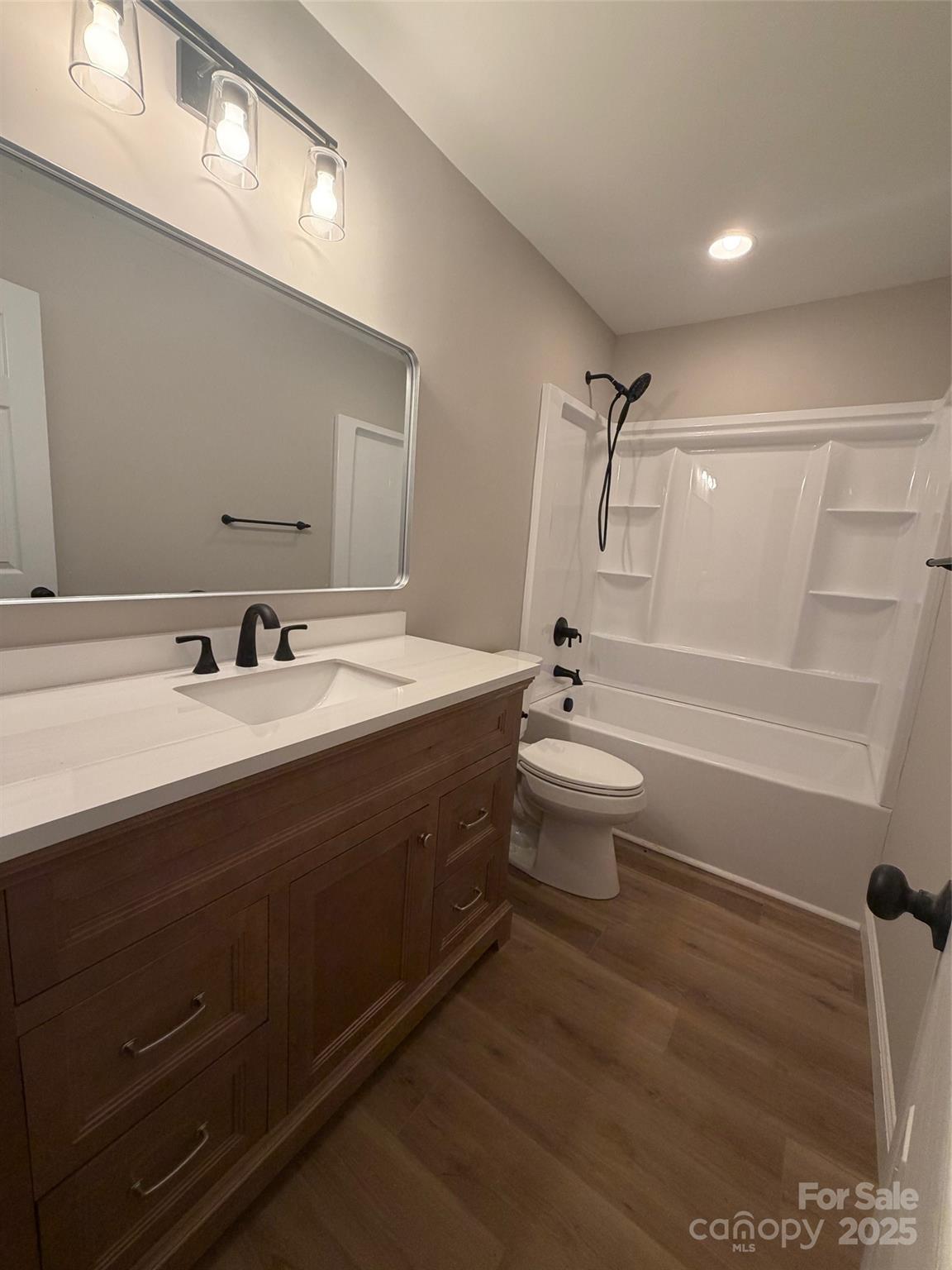 1470 Requa Road Cherryville, NC 28021 - Photo 8 of 28 a bathroom with a double vanity sink toilet and shower