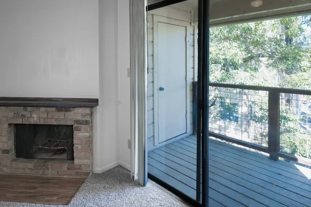 a view of a livingroom with furniture and a fireplace