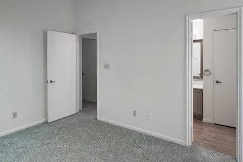 an empty room with closet area