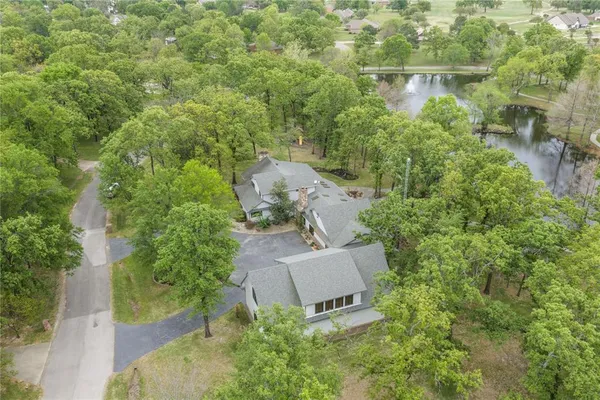 an aerial view of a house with outdoor space and street view