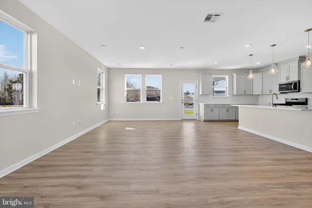 a view of kitchen and wooden floor