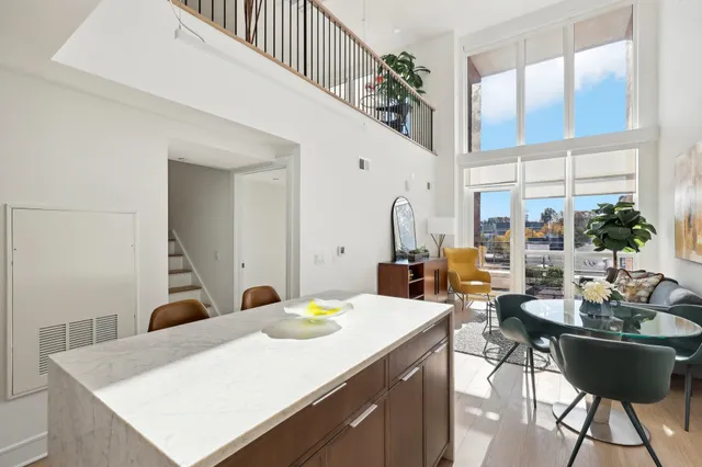 a large kitchen with a table and chairs
